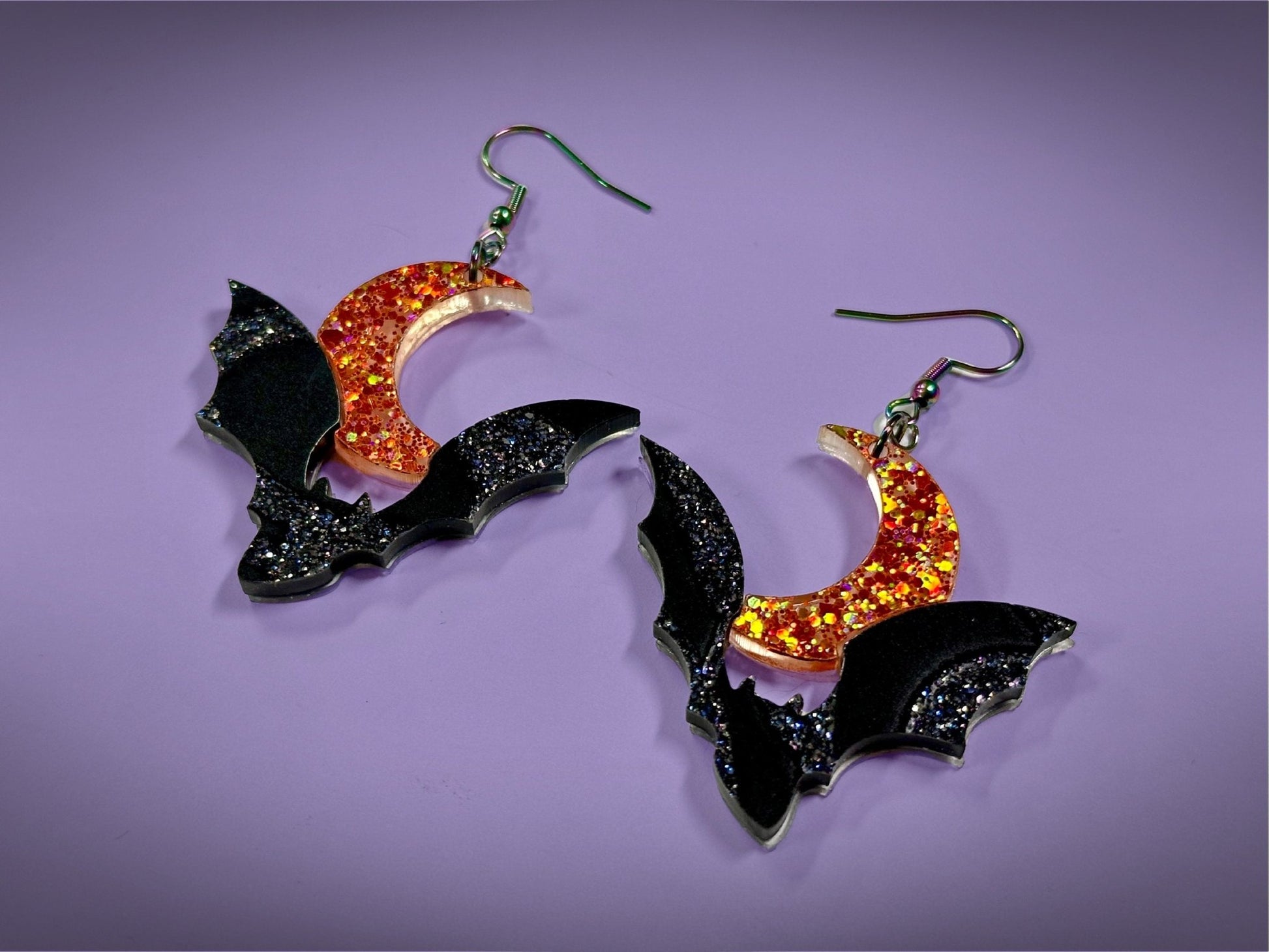 Bat and Crescent Moon Earrings | Asymmetrical Black Crackle and Holographic Orange Glitter Halloween Dangles - Painted Raina