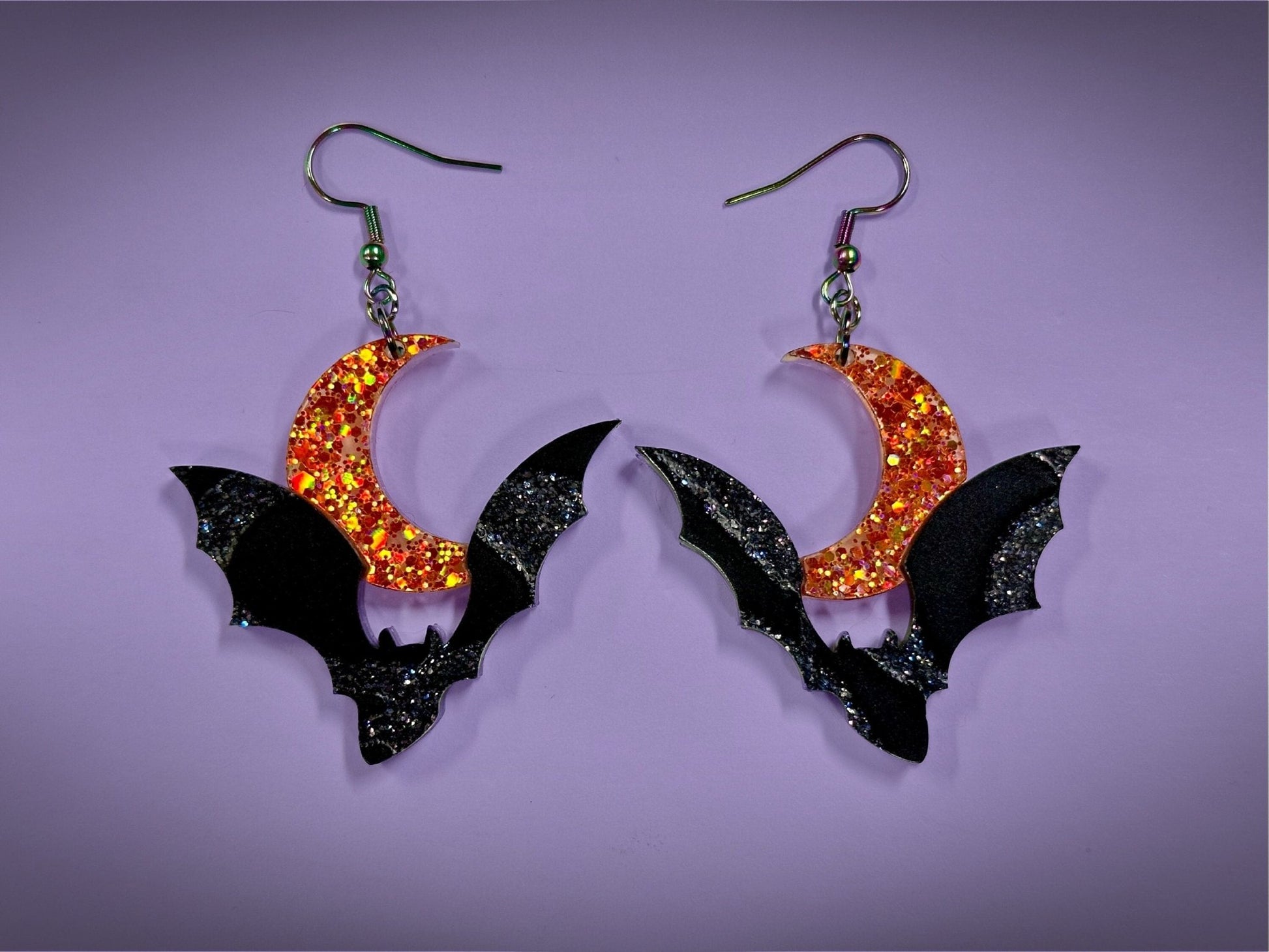 Bat and Crescent Moon Earrings | Asymmetrical Black Crackle and Holographic Orange Glitter Halloween Dangles - Painted Raina