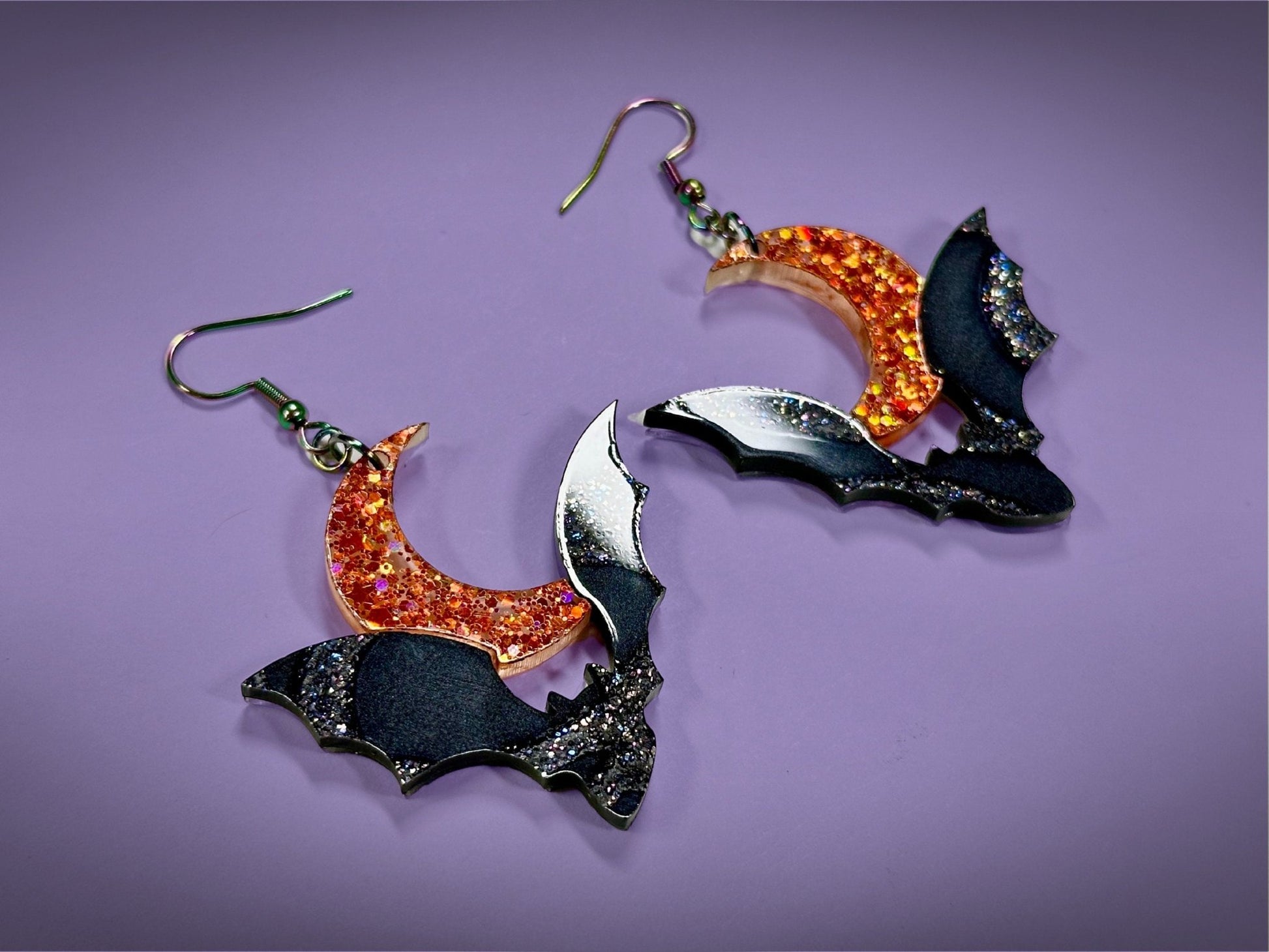 Bat and Crescent Moon Earrings | Asymmetrical Black Crackle and Holographic Orange Glitter Halloween Dangles - Painted Raina