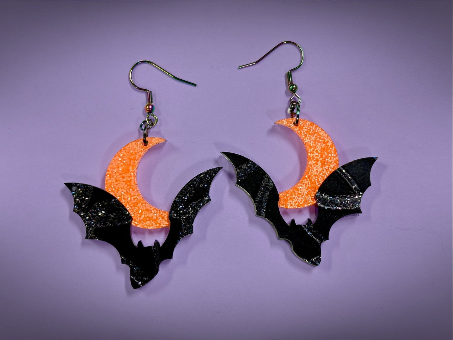 Bat and Crescent Moon Earrings | Asymmetrical Black Crackle and Holo Orange Glitter Halloween Dangles - Painted Raina