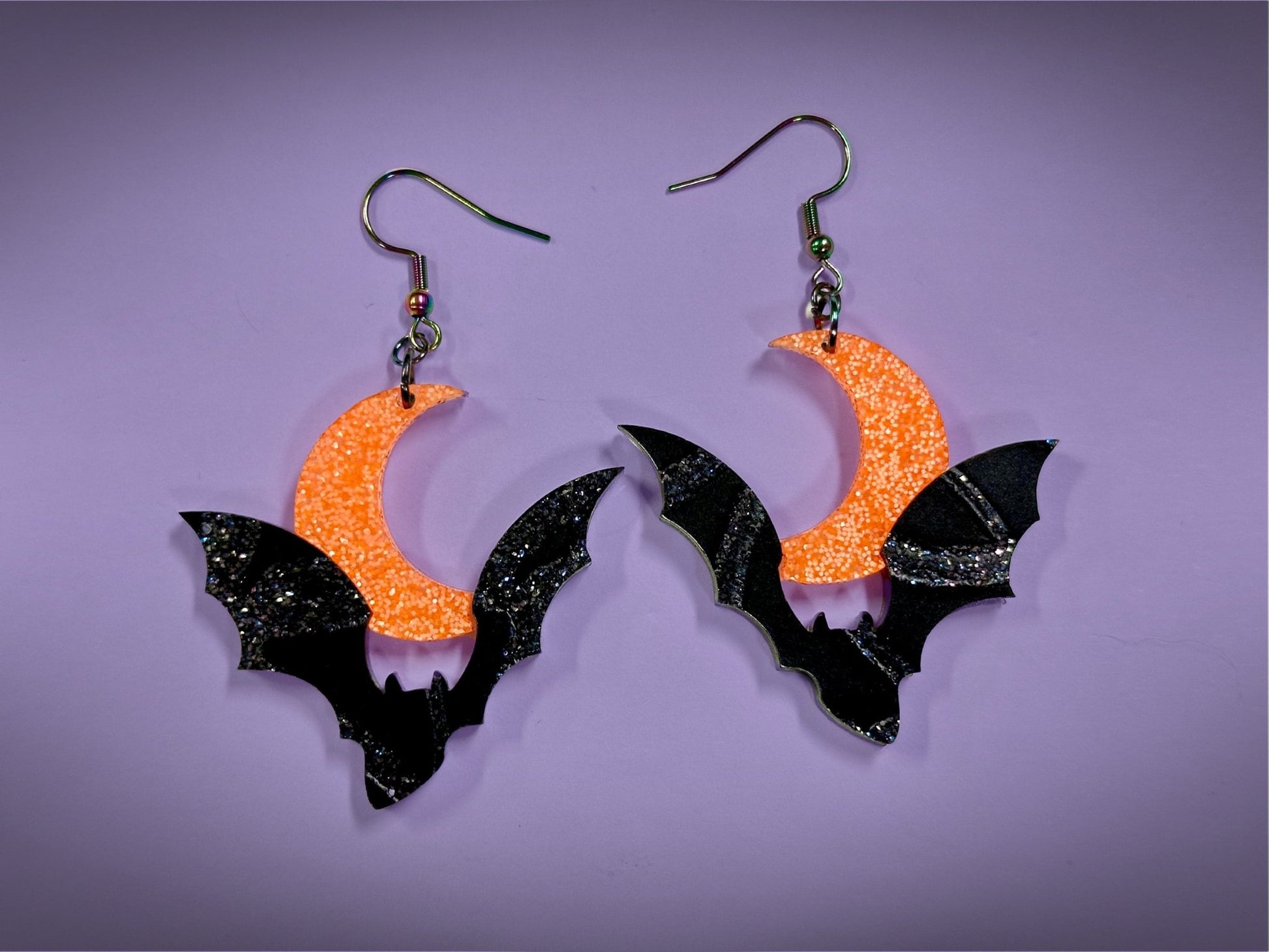Bat and Crescent Moon Earrings | Asymmetrical Black Crackle and Holo Orange Glitter Halloween Dangles - Painted Raina