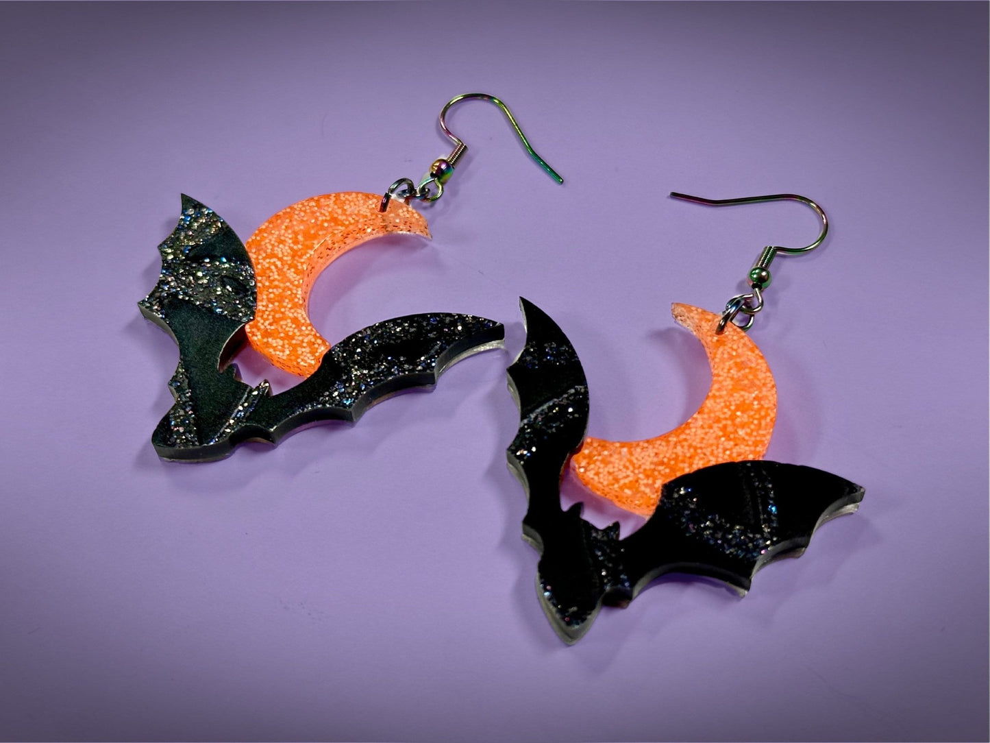 Bat and Crescent Moon Earrings | Asymmetrical Black Crackle and Holo Orange Glitter Halloween Dangles - Painted Raina