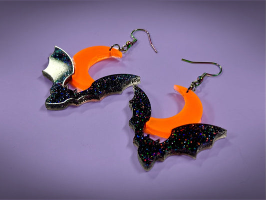 Bat and Crescent Moon Earrings | Asymmetrical Black Rainbow Glitter and Neon Matte Orange Halloween Dangles - Painted Raina