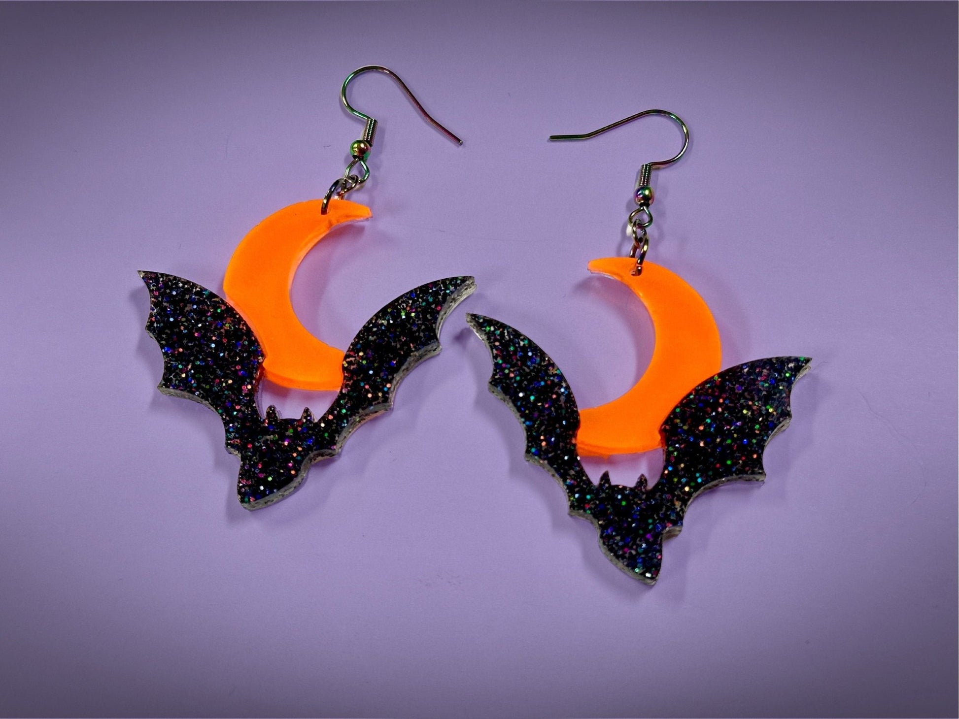 Bat and Crescent Moon Earrings | Asymmetrical Black Rainbow Glitter and Neon Matte Orange Halloween Dangles - Painted Raina