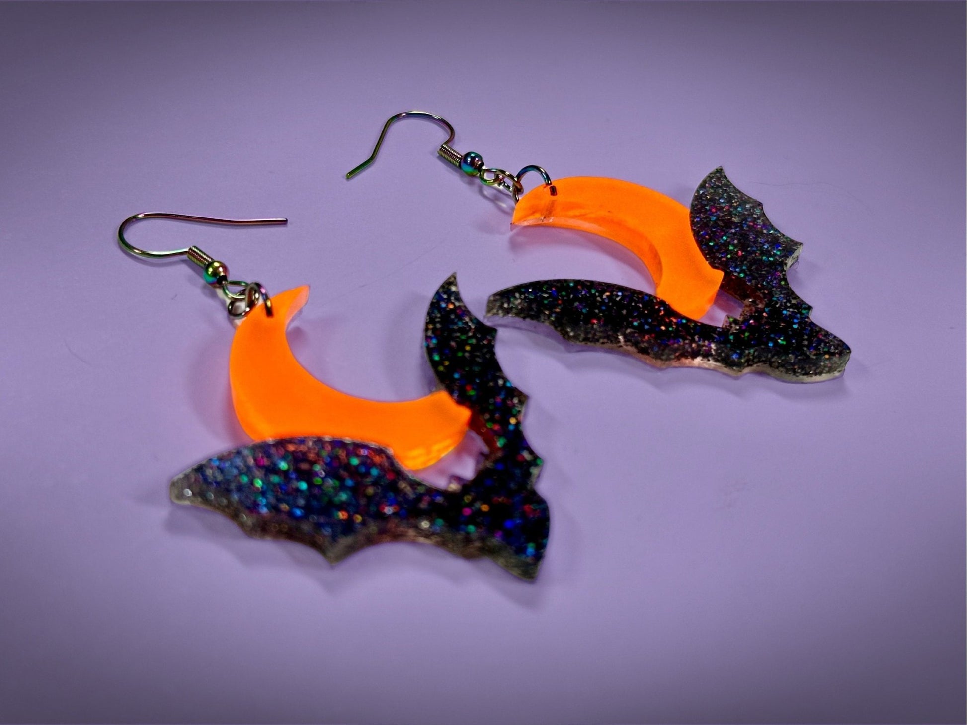 Bat and Crescent Moon Earrings | Asymmetrical Black Rainbow Glitter and Neon Matte Orange Halloween Dangles - Painted Raina