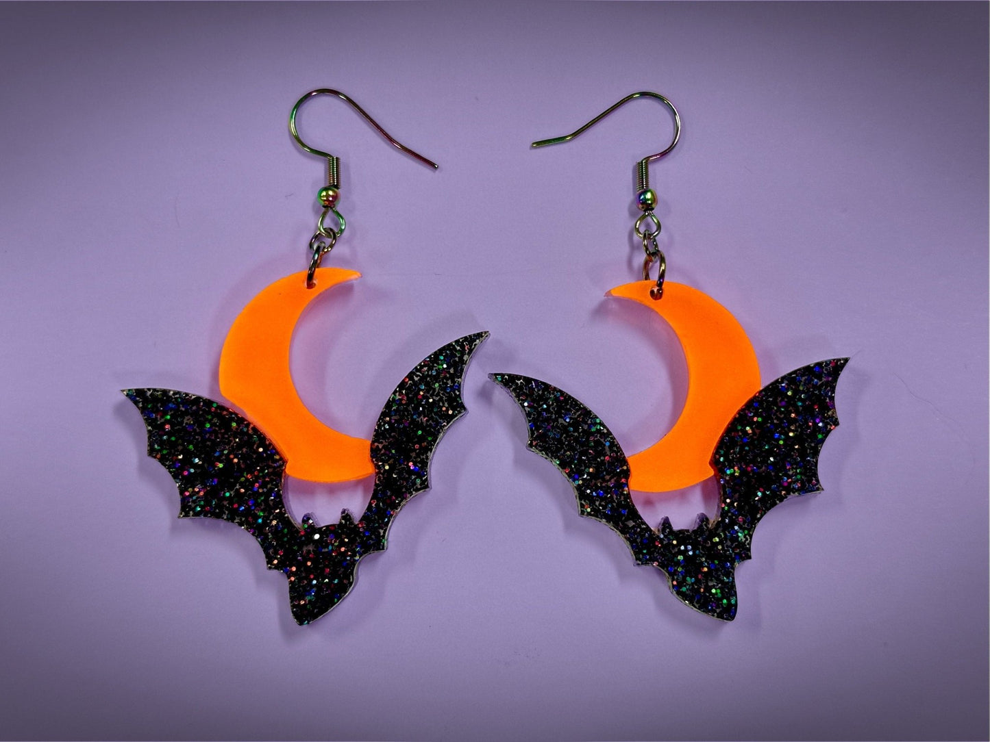 Bat and Crescent Moon Earrings | Asymmetrical Black Rainbow Glitter and Neon Matte Orange Halloween Dangles - Painted Raina