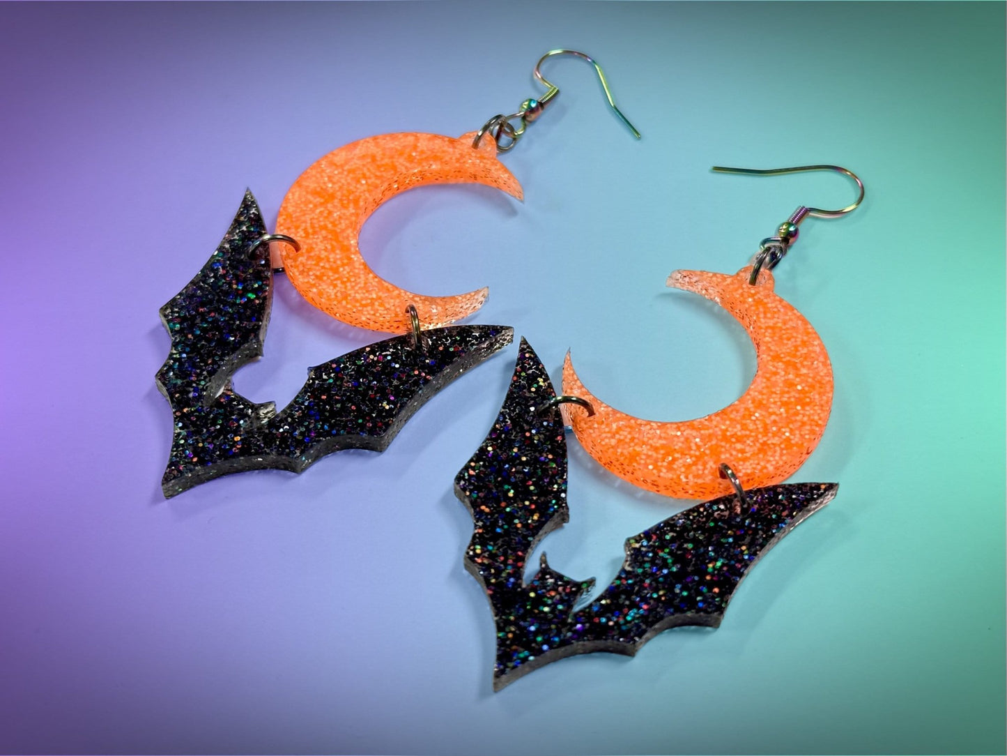 Bat and Crescent Moon Earrings | Black Rainbow Glitter and Neon Orange Glitz Halloween Dangles ! - Painted Raina