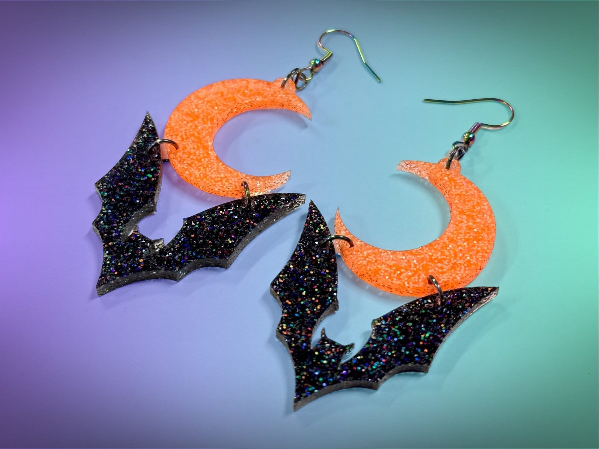 Bat and Crescent Moon Earrings | Black Rainbow Glitter and Neon Orange Glitz Halloween Dangles ! - Painted Raina