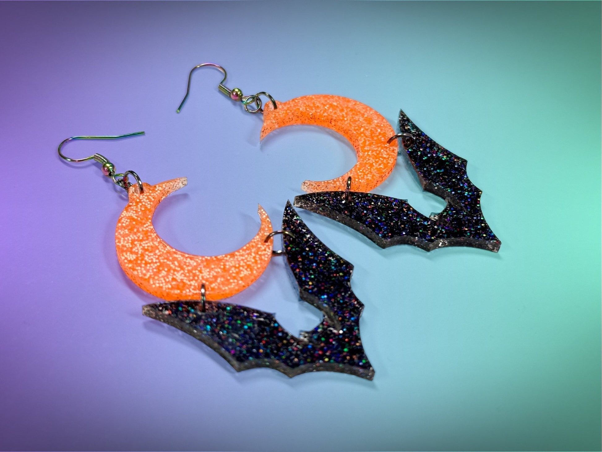 Bat and Crescent Moon Earrings | Black Rainbow Glitter and Neon Orange Glitz Halloween Dangles ! - Painted Raina