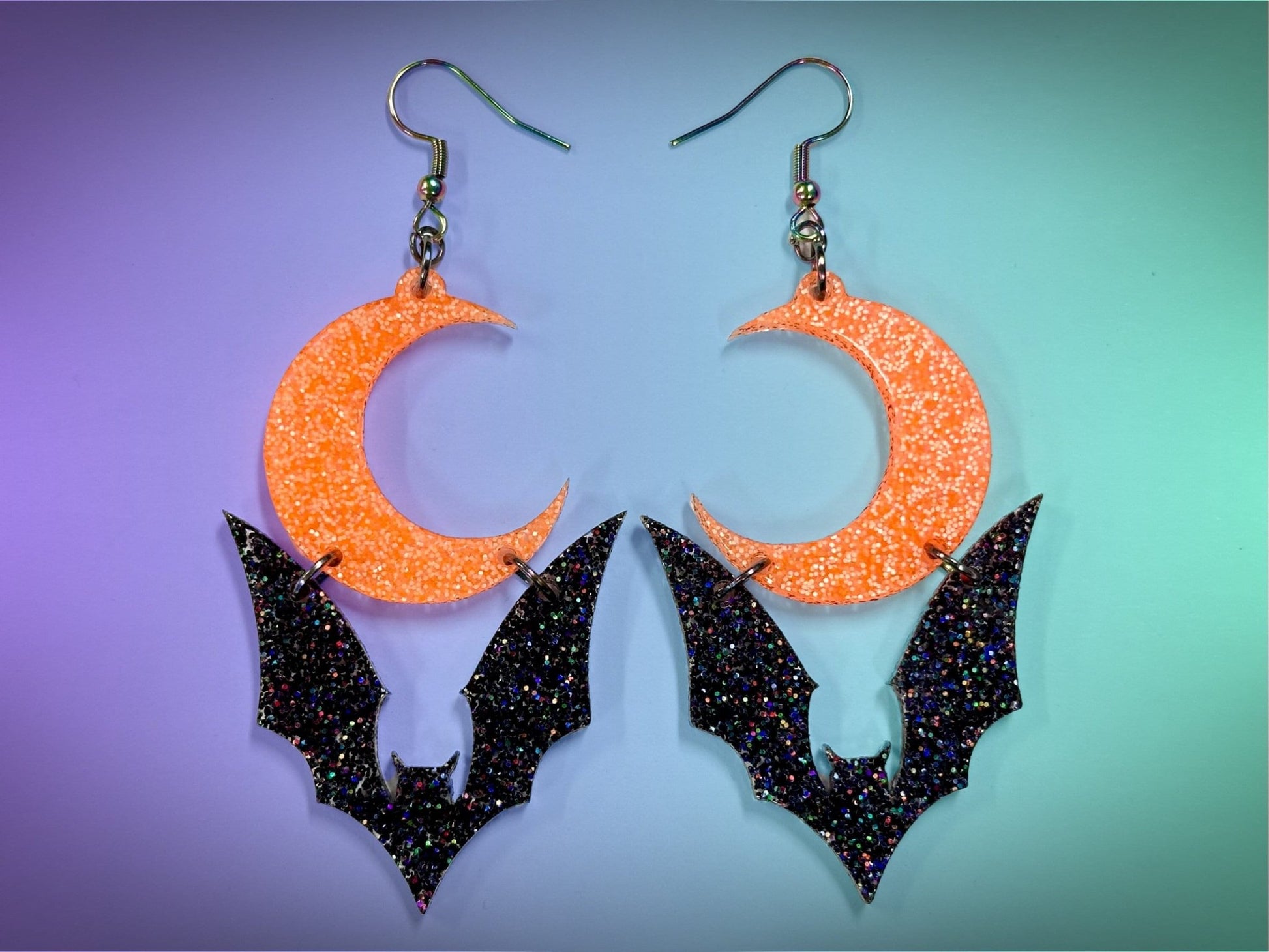 Bat and Crescent Moon Earrings | Black Rainbow Glitter and Neon Orange Glitz Halloween Dangles ! - Painted Raina