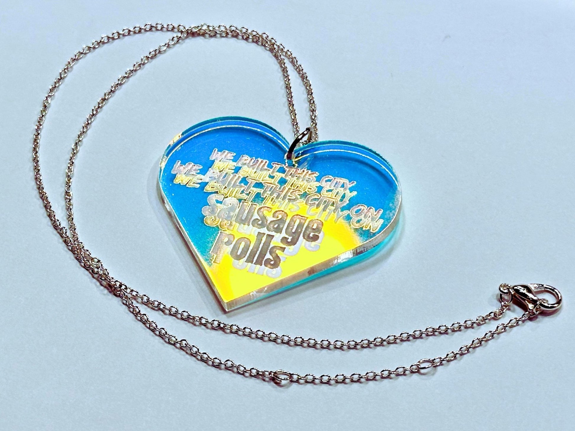 Misheard Lyrics Pendant | We Built This City on Sausage Rolls - Painted Raina