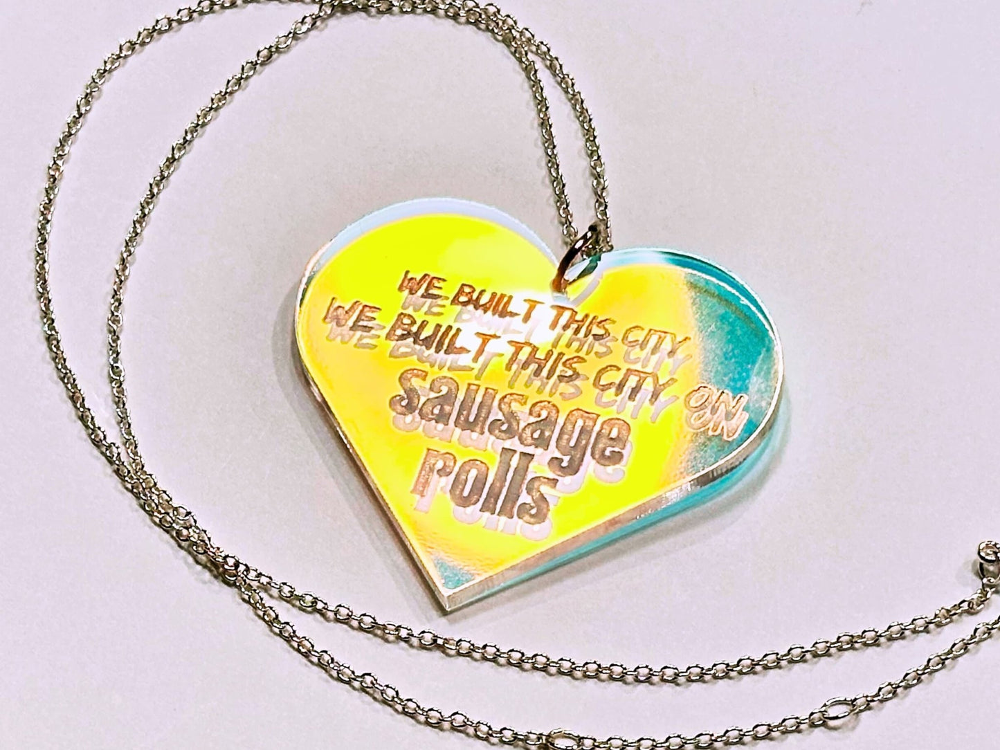 Misheard Lyrics Pendant | We Built This City on Sausage Rolls - Painted Raina