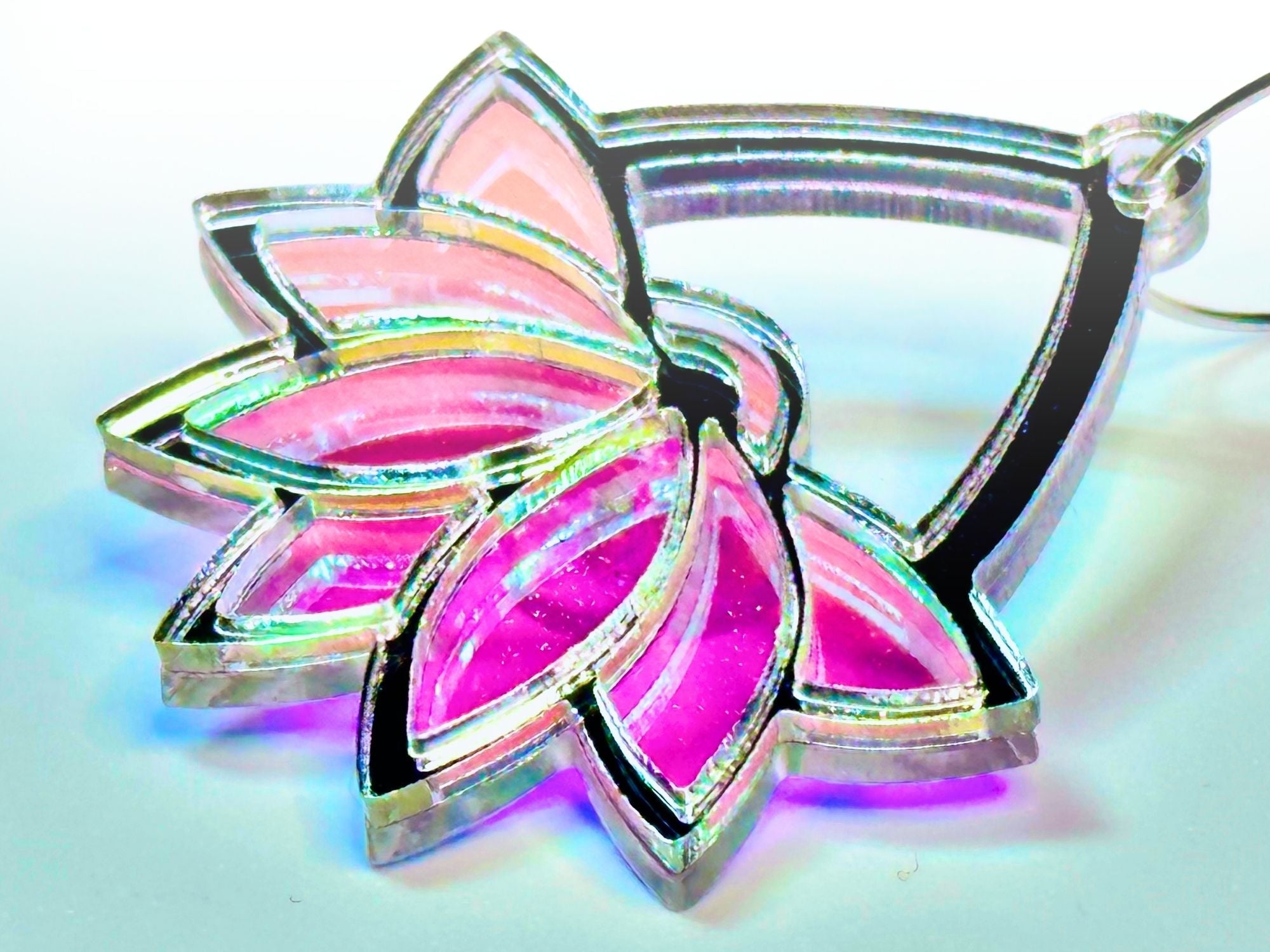 Close-up detail of Silversteel Art Deco lotus earring showing layered acrylic construction