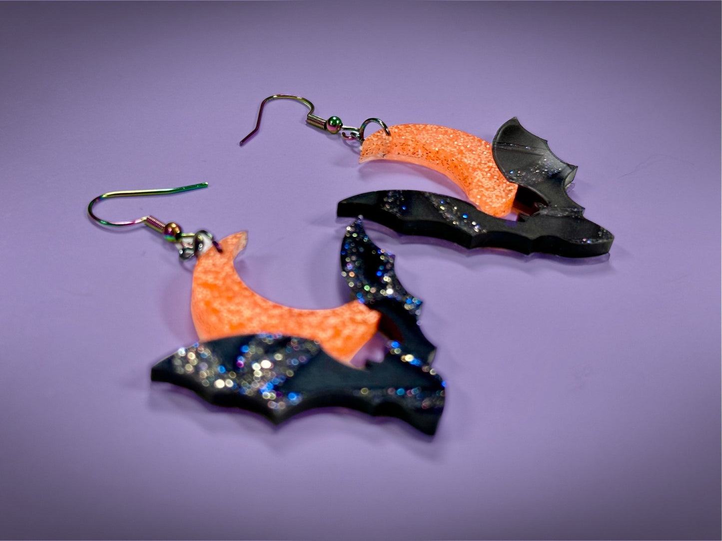 Bat and Crescent Moon Earrings | Asymmetrical Black Crackle and Holographic Harvest Orange Glitter Halloween Dangles ! - Painted Raina