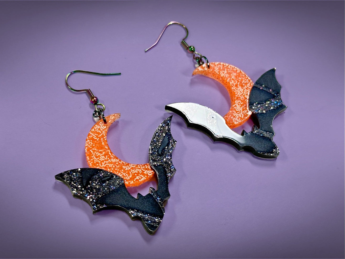 Bat and Crescent Moon Earrings | Asymmetrical Black Crackle and Holographic Harvest Orange Glitter Halloween Dangles ! - Painted Raina