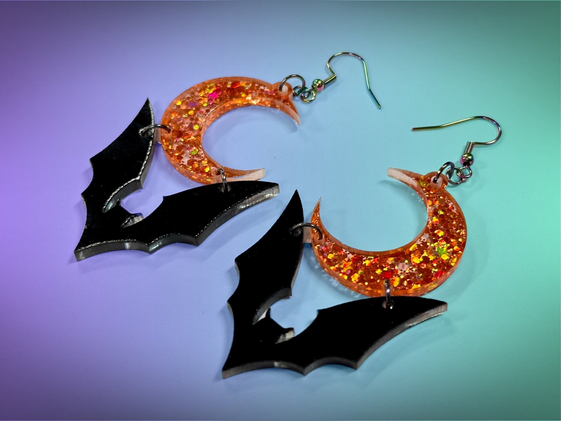 Bat and Crescent Moon Earrings | Black and Holographic Harvest Orange Glitter Halloween Dangles ! - Painted Raina