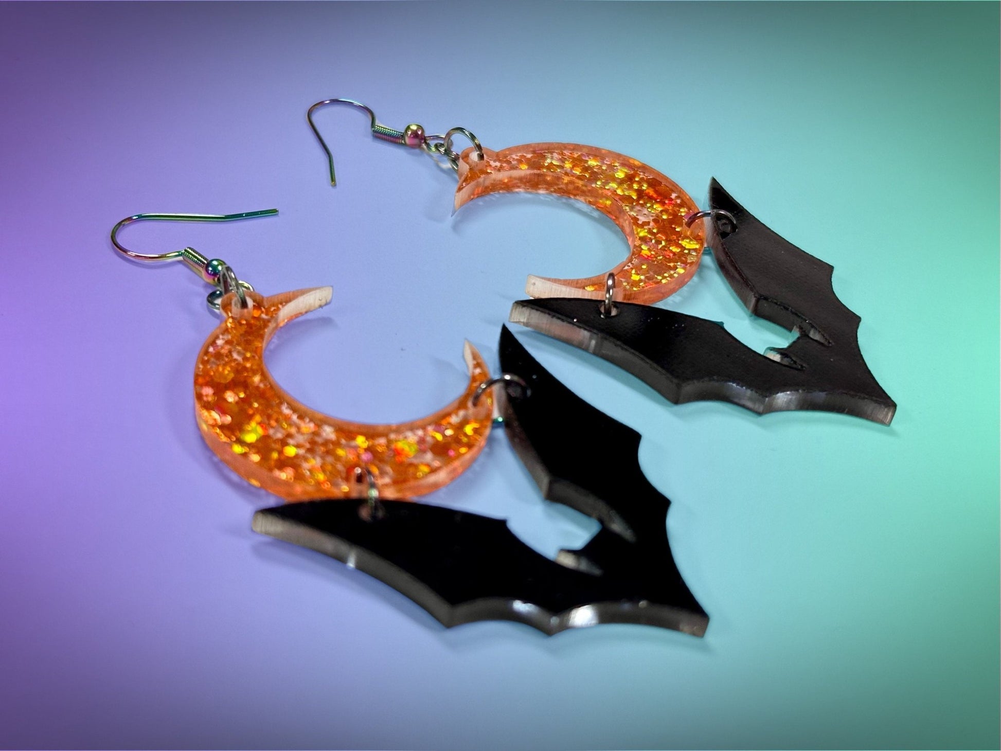 Bat and Crescent Moon Earrings | Black and Holographic Harvest Orange Glitter Halloween Dangles ! - Painted Raina