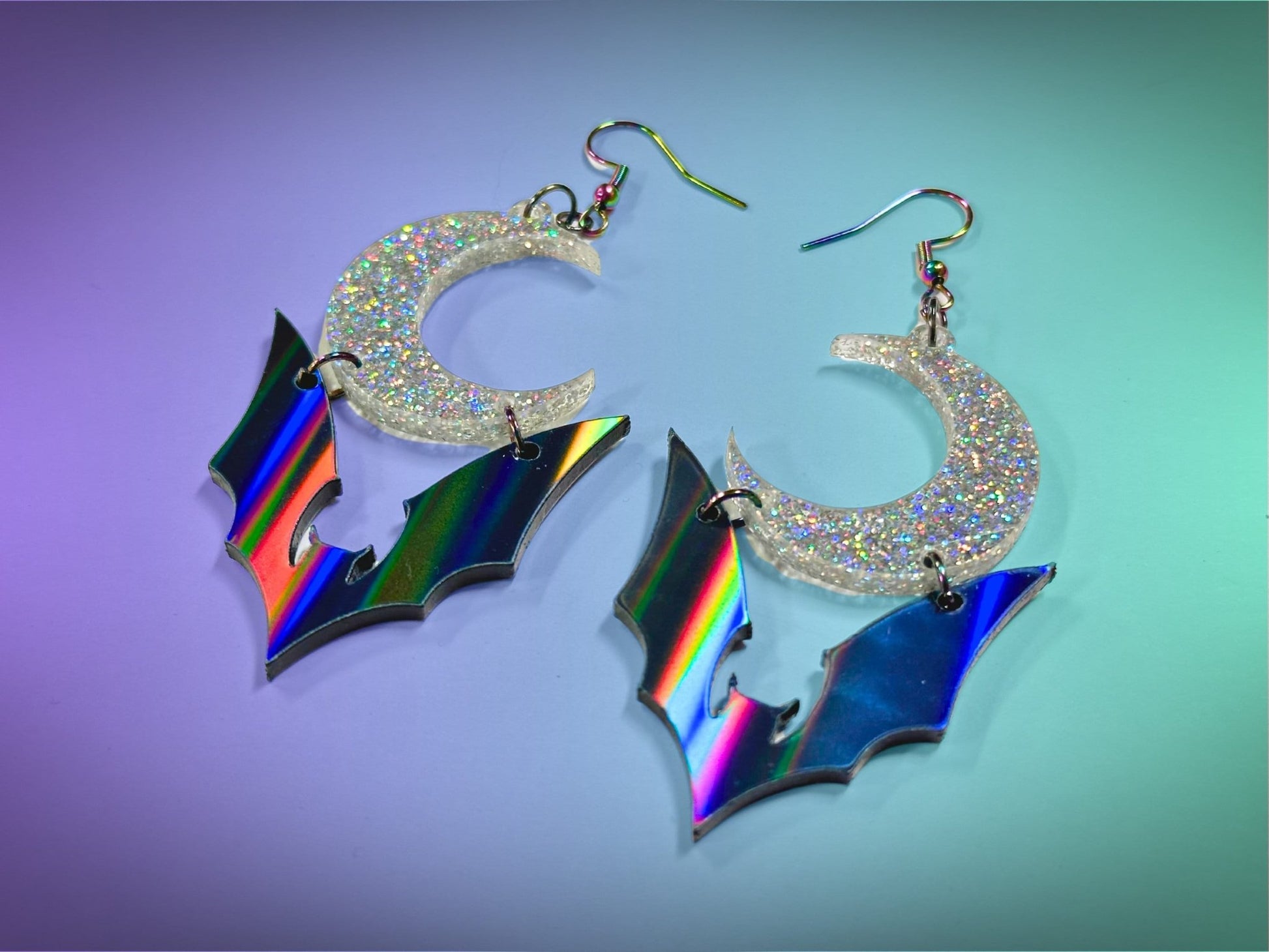 Bat and Crescent Moon Earrings | Black Rainbow and Silver Holographic Glitter Halloween Dangles ! - Painted Raina