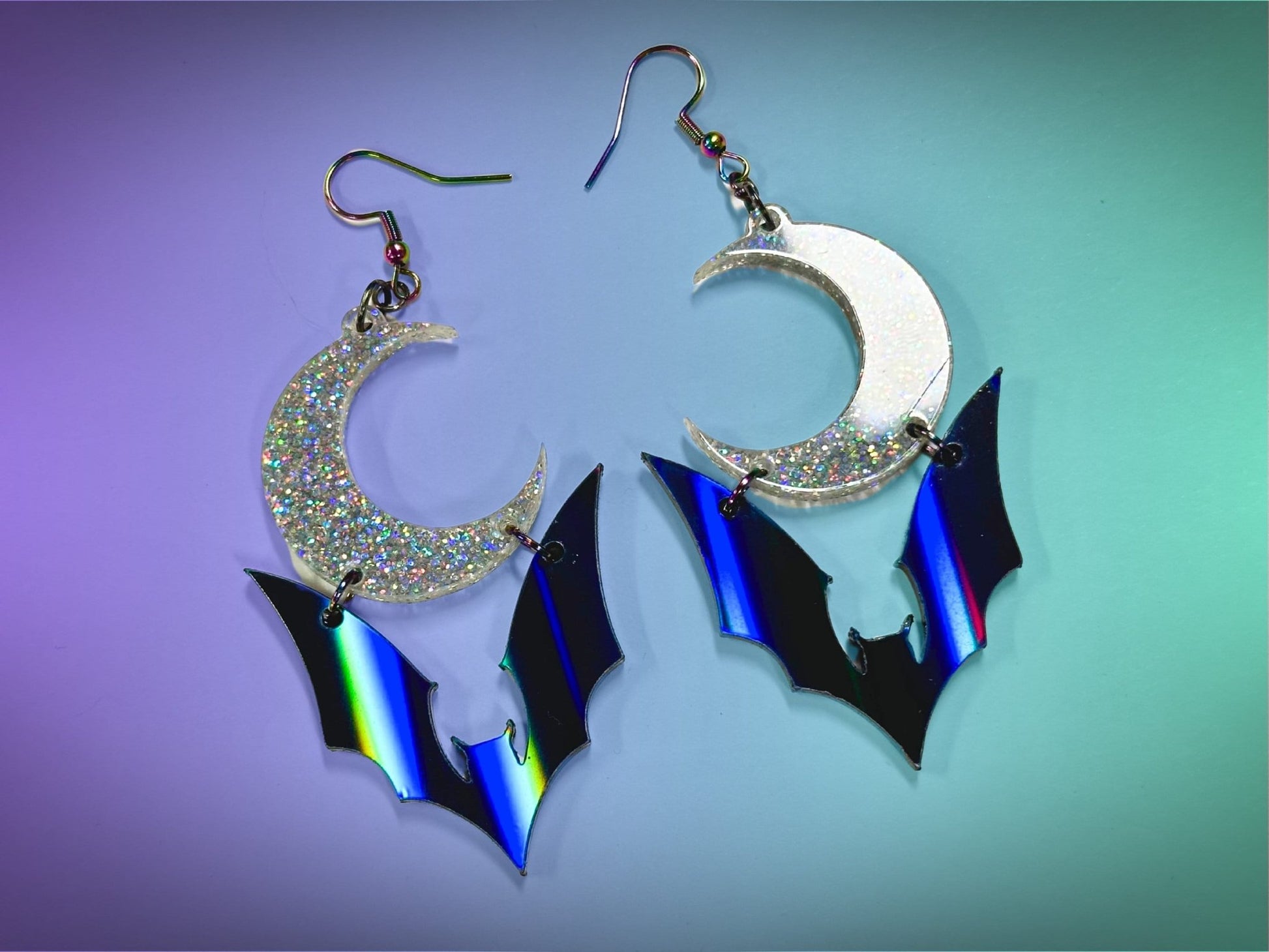 Bat and Crescent Moon Earrings | Black Rainbow and Silver Holographic Glitter Halloween Dangles ! - Painted Raina