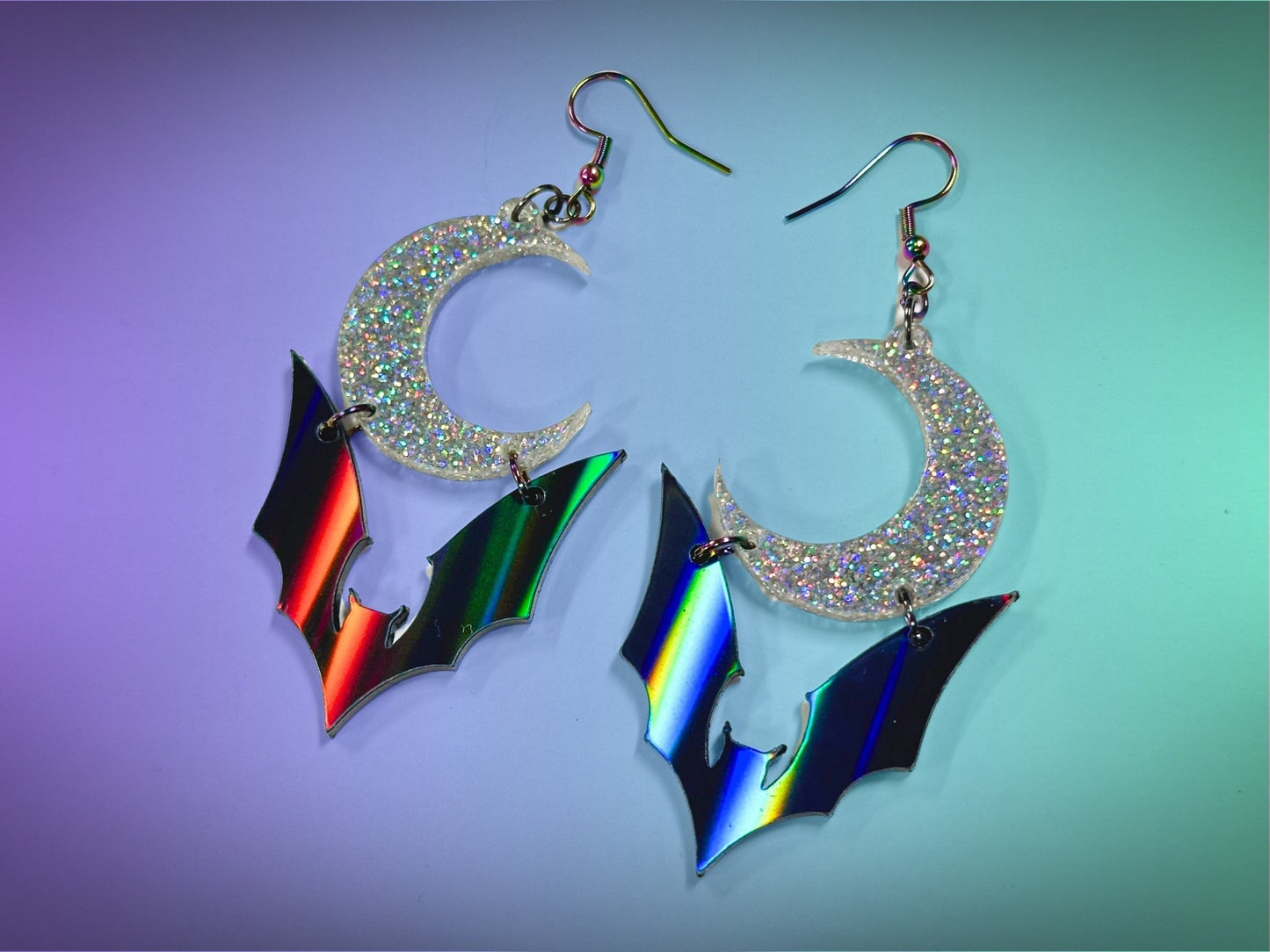 Bat and Crescent Moon Earrings | Black Rainbow and Silver Holographic Glitter Halloween Dangles ! - Painted Raina