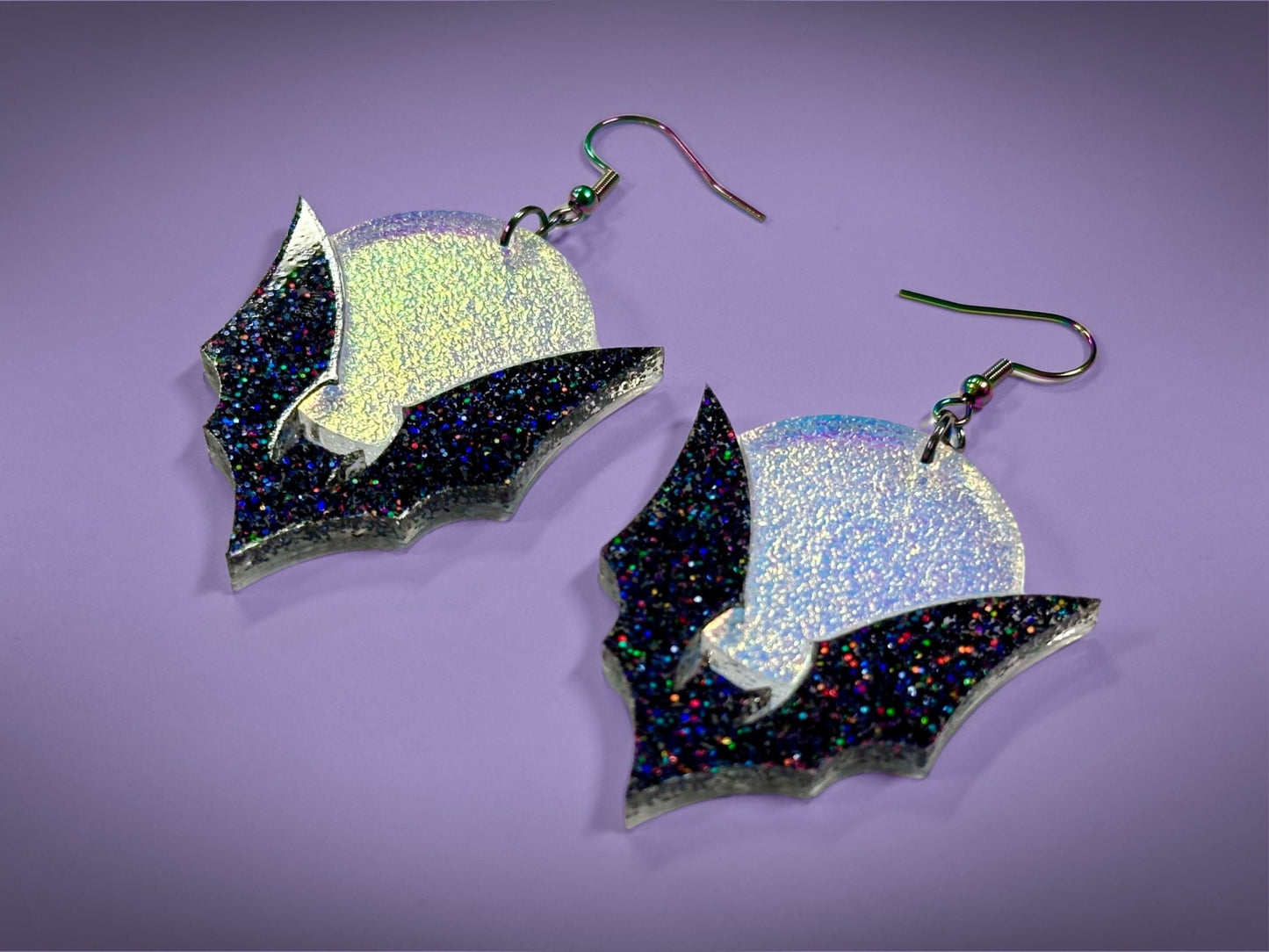 Bat and Full Moon Earrings | Black Rainbow Glitter and Textured Iridescent Halloween Dangles - Painted Raina