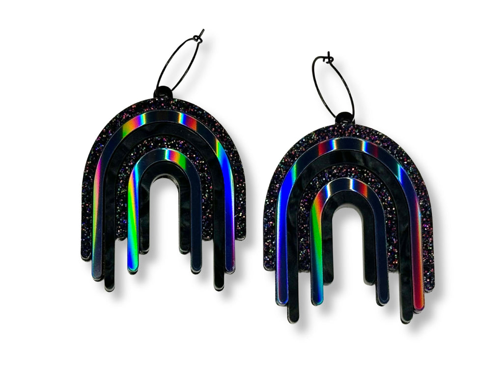 Full Spectrum Rebel Drip Earrings in Black Rainbow layered acrylic with holographic glitter and iridescent finishes on white background