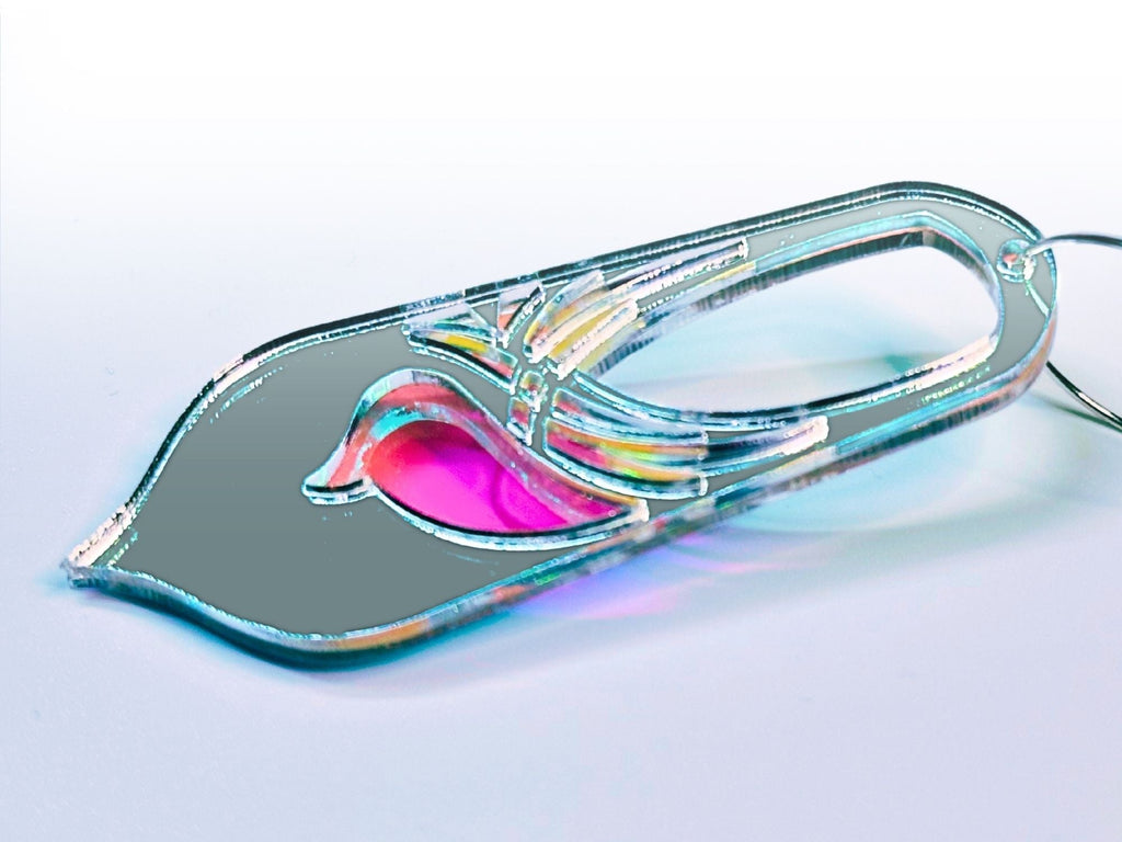 Silver mirror and pink iridescent Bronwyn statement earrings on soft gradient background