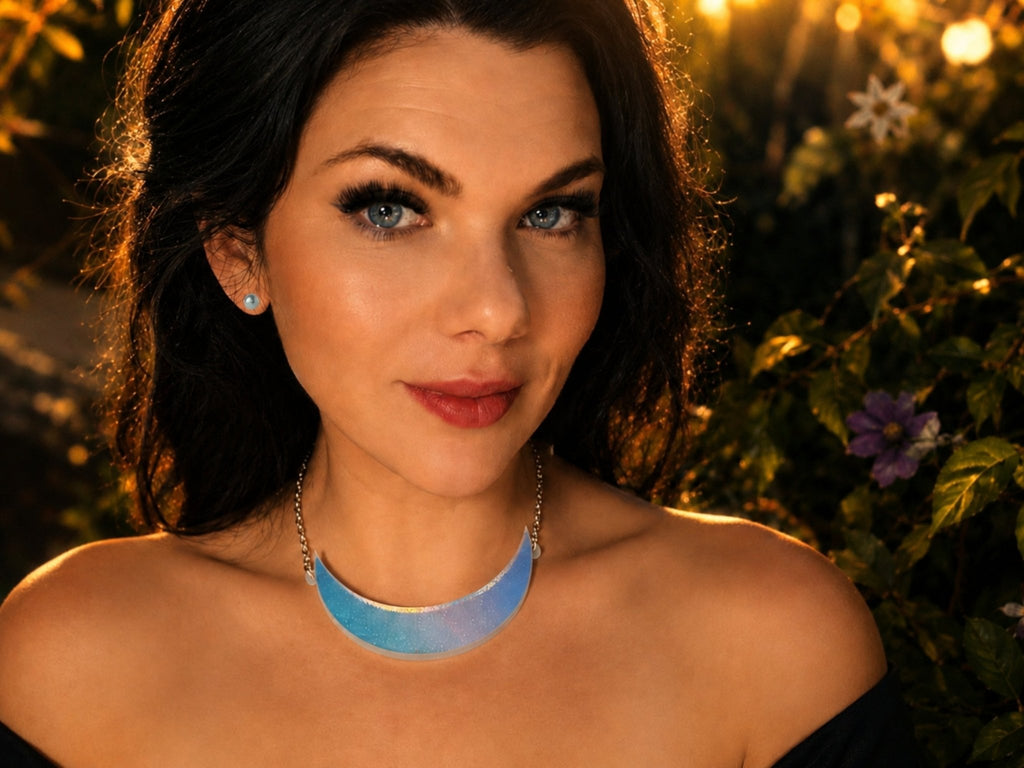 Model wearing iridescent crescent moon statement collar necklace