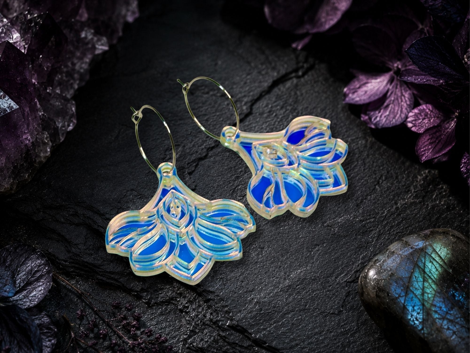 Moonglass Deco Bloom earrings styled on dark editorial flatlay