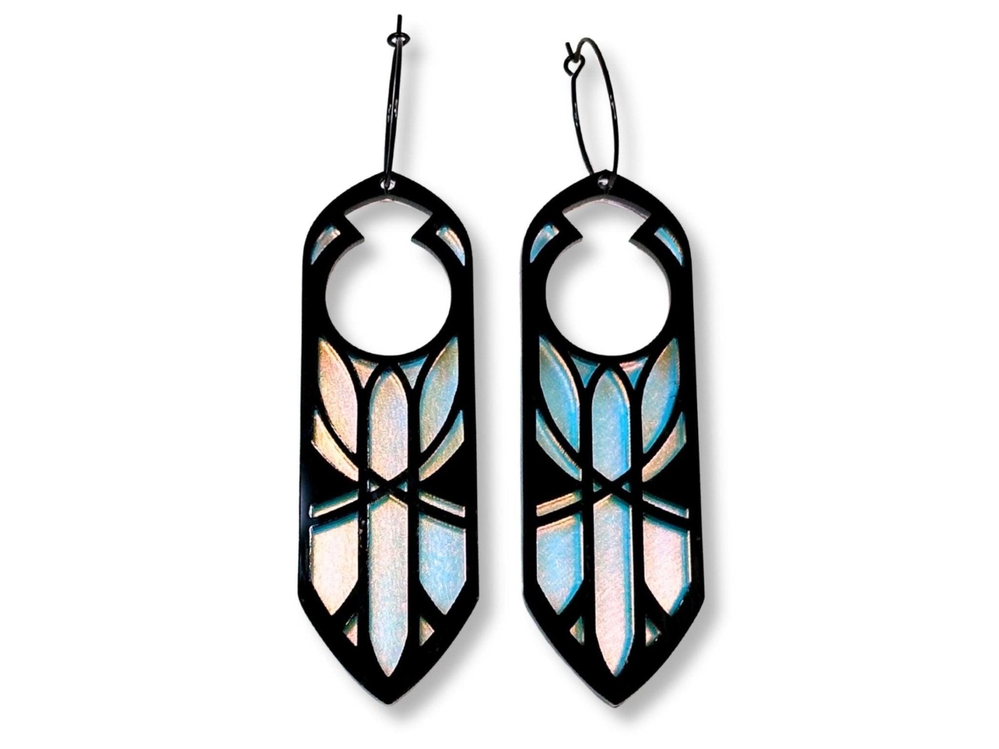Black and iridescent Disa statement earrings inspired by fantasy dwarf queen aesthetics on white background