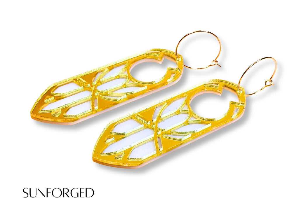 Gold mirror Sunforged Disa statement earrings on white background