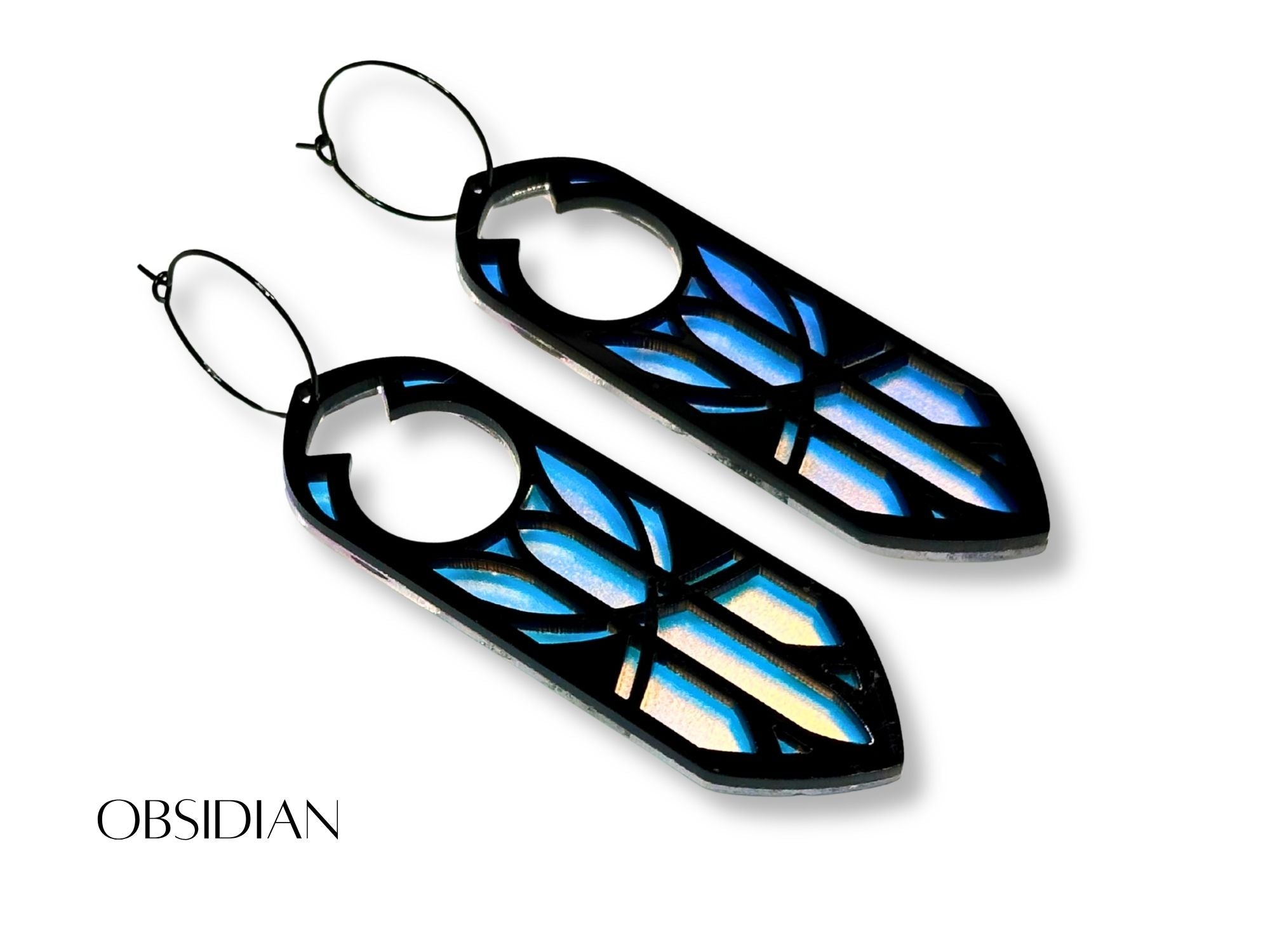 Black and blue iridescent Obsidian Disa statement earrings on white background