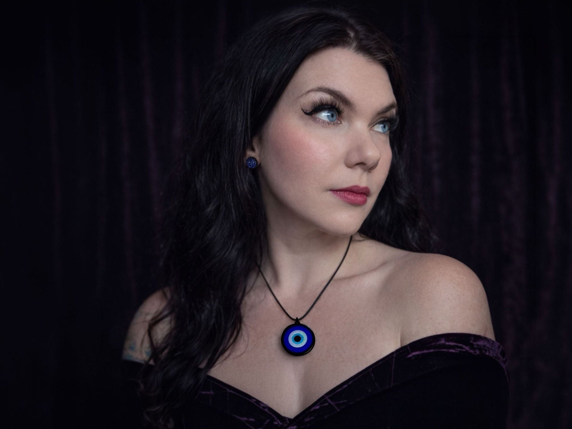 evil eye pendant necklace worn on model lightweight talisman jewelry everyday styling