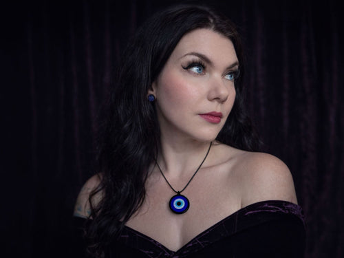 evil eye pendant necklace worn on model lightweight talisman jewelry everyday styling