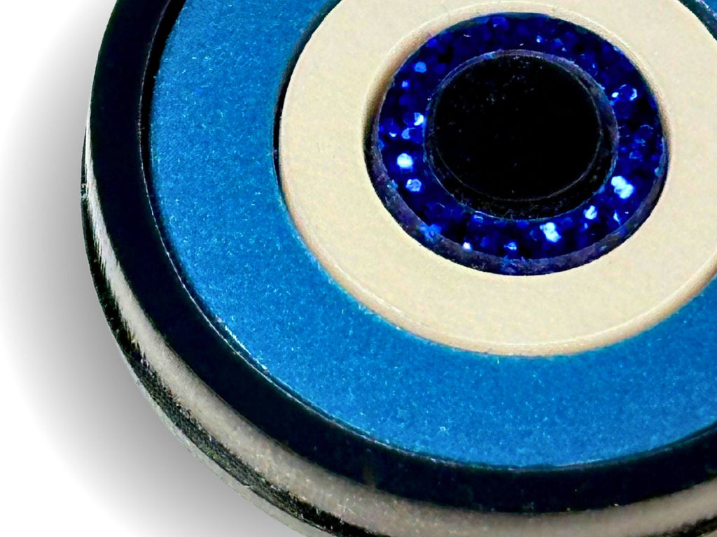 layered construction of evil eye pendant necklace showing dimensional acrylic design detail macro close up blue white black