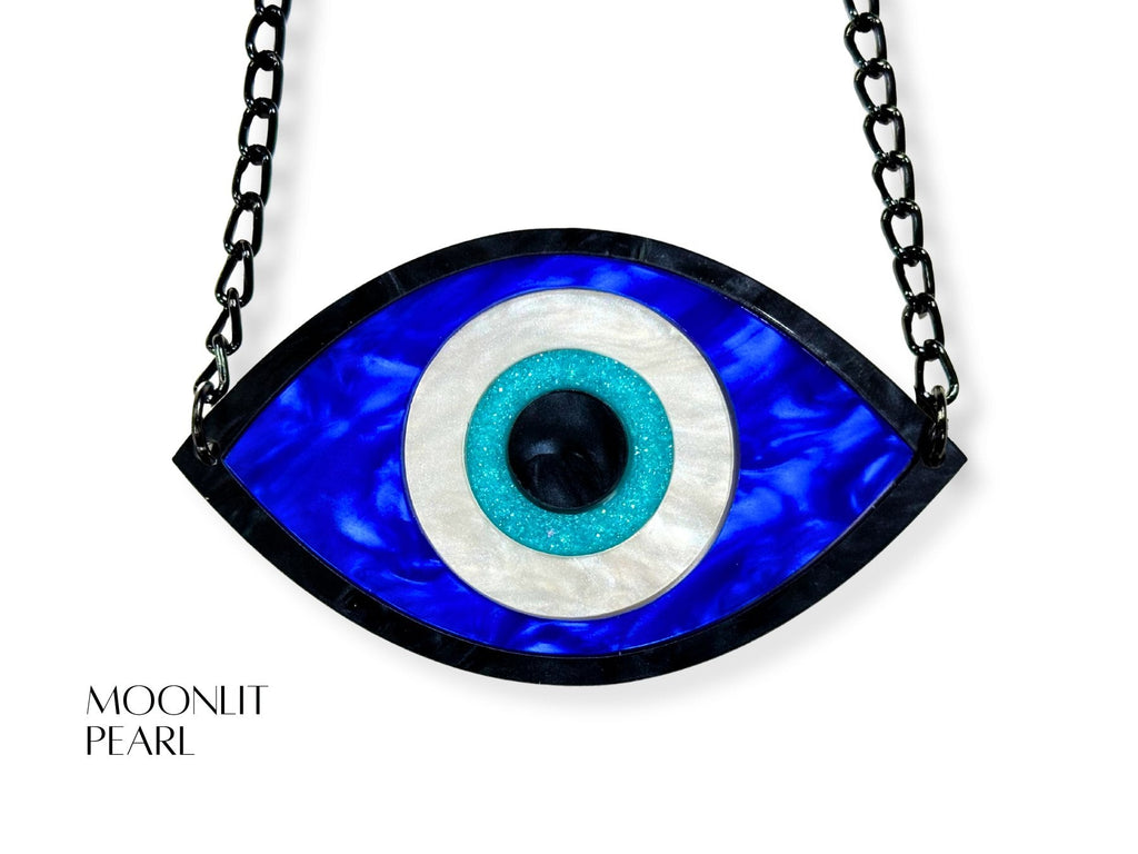 evil eye necklace detail showing texture variations pearl acrylic finishes