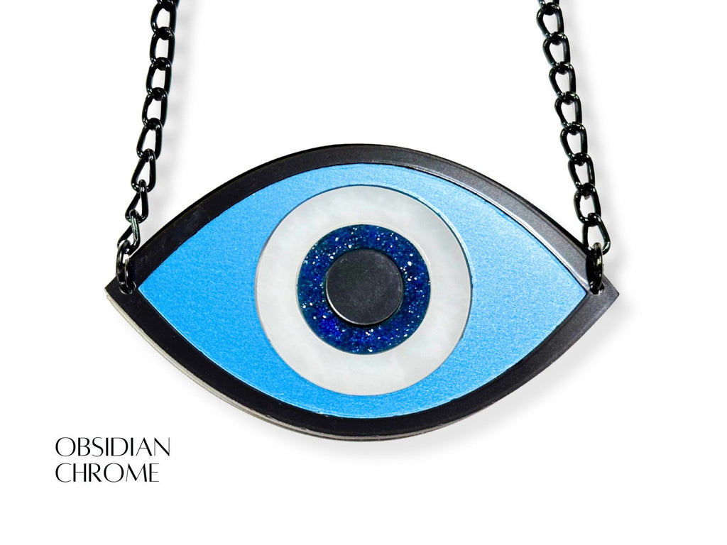 evil eye necklace detail showing texture variation metallic acrylic finishes