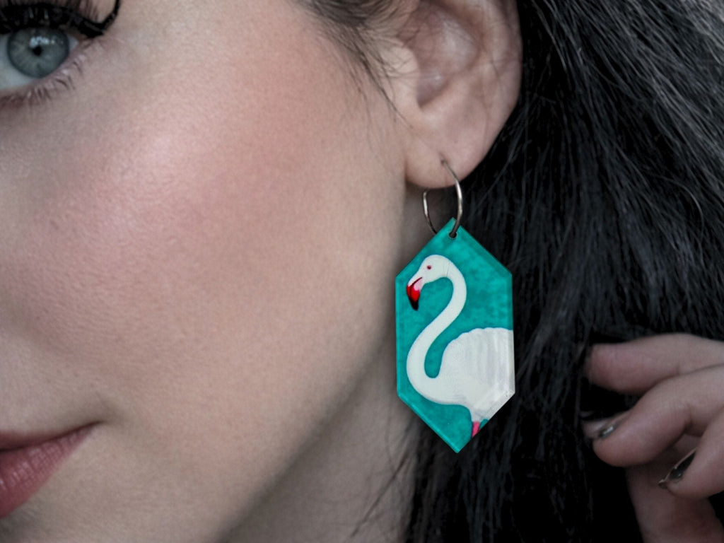 Woman wearing Green Goddess flamingo statement earrings