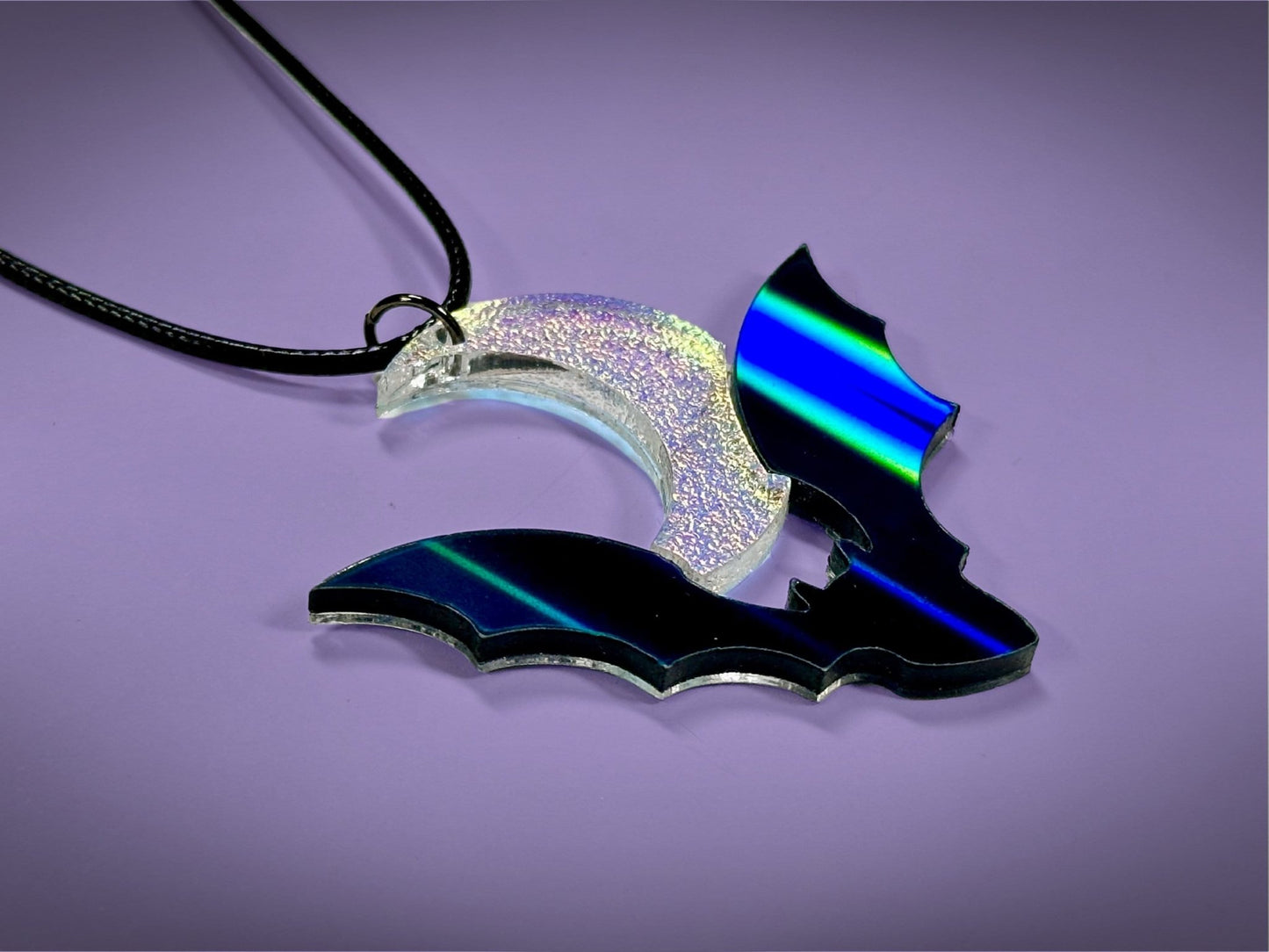 Flying Bat and Crescent Moon Pendant | Black Rainbow Holographic and Textured Iridescent Halloween Necklace - Painted Raina