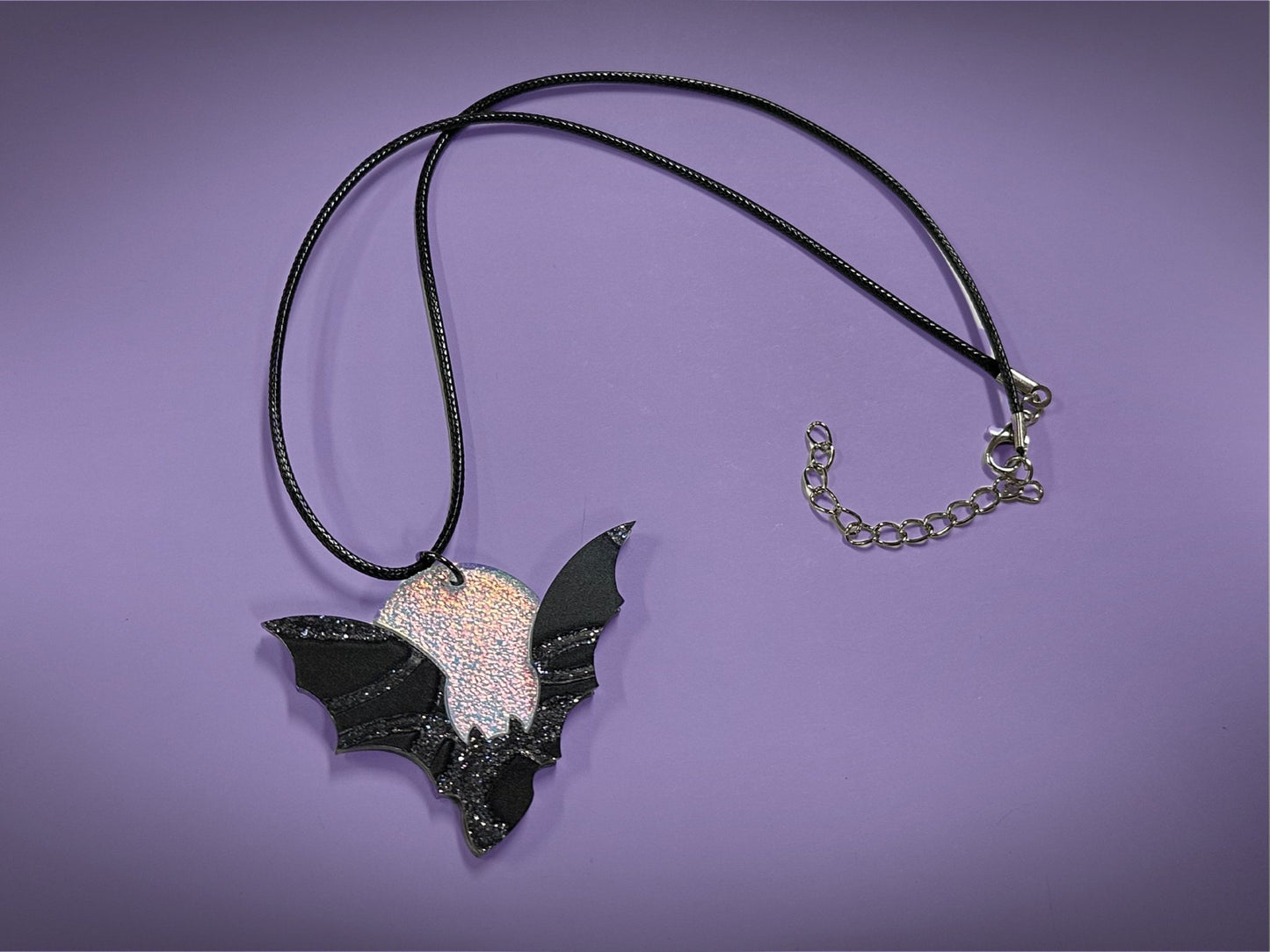 Flying Bat and Full Moon Pendant | Black Crackle Glitter and Textured Iridescent Halloween Necklace - Painted Raina