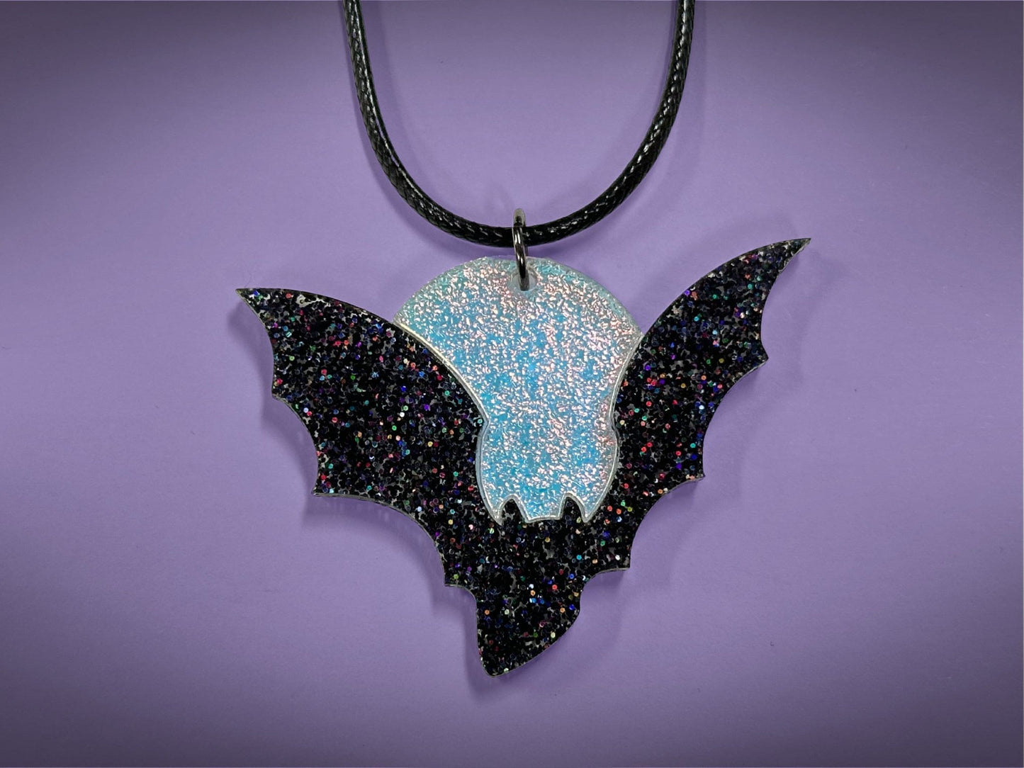 Flying Bat and Full Moon Pendant | Black Rainbow Holographic Glitter & Textured Iridescent Halloween Necklace - Painted Raina