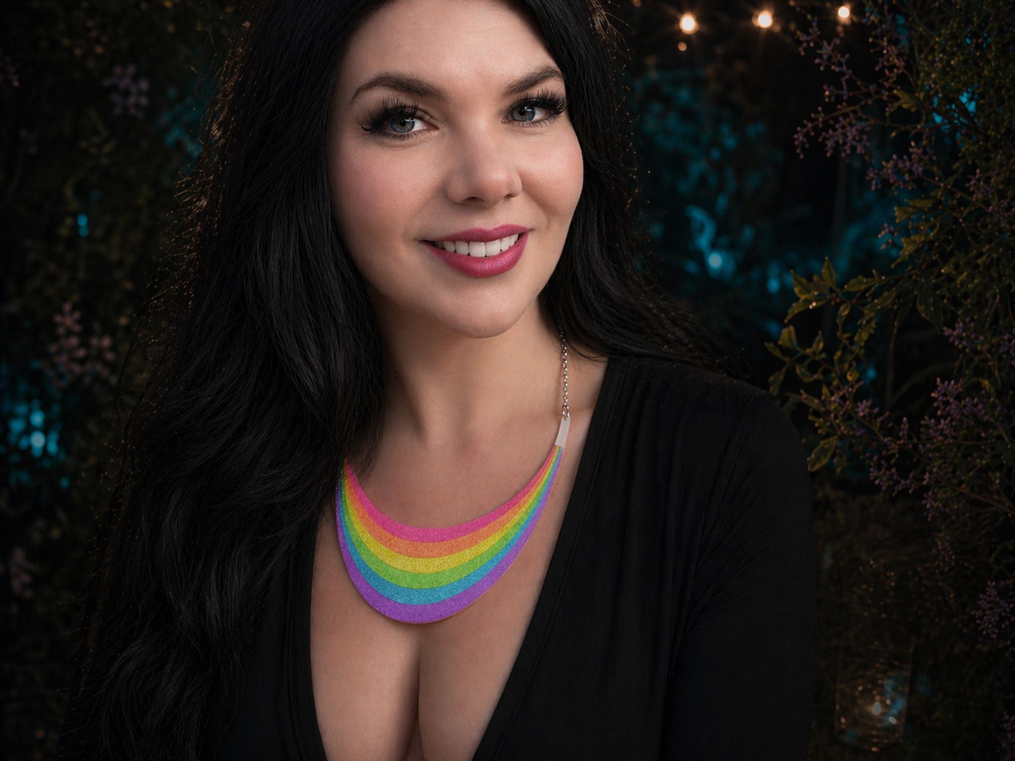 Model wearing Full Spectrum Rebel Rainbow Rave rainbow arc statement necklace in glitter acrylic.