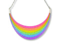 Full Spectrum Rebel Arc Statement Necklace in Rainbow Rave glitter acrylic with silver chain on white background.