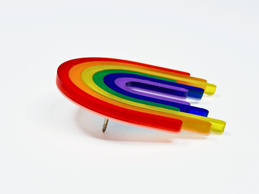 Side angle view of layered rainbow acrylic brooch