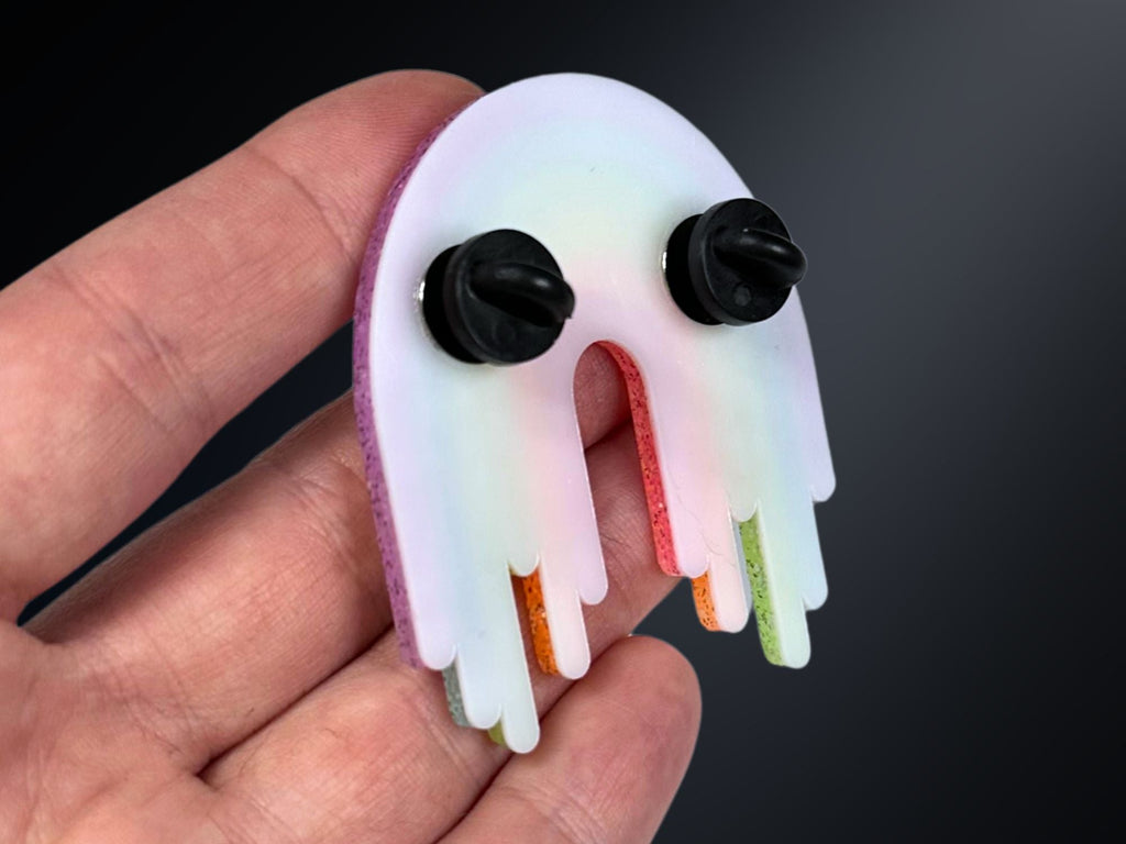 Back view of Full Spectrum Rebel Rainbow Rave brooch showing dual pin backing and white acrylic backer.