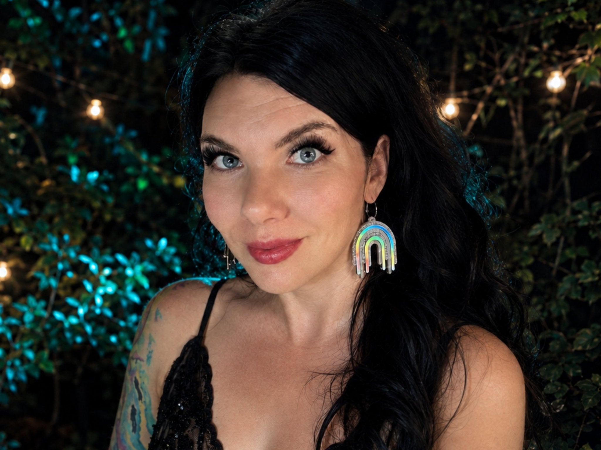 Model wearing Full Spectrum Rebel Drip Earrings in Disco Prism