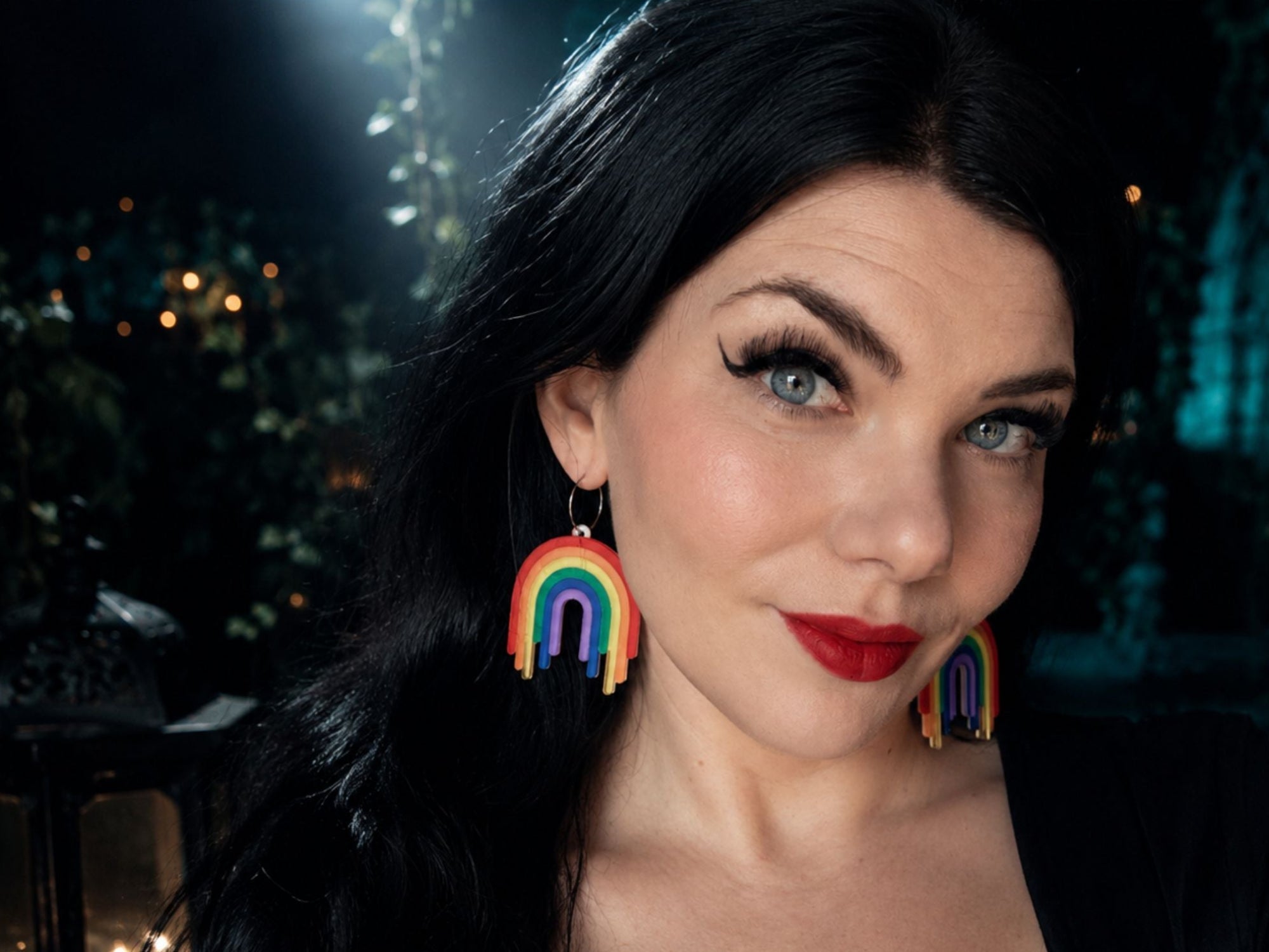 Model wearing Full Spectrum Rebel Drip Earrings rainbow statement earrings