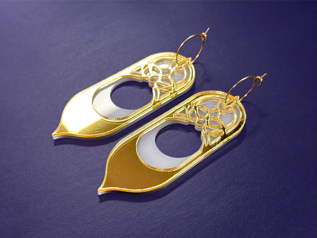 Gold mirror Sunforged Galadriel statement earrings photographed on deep purple background