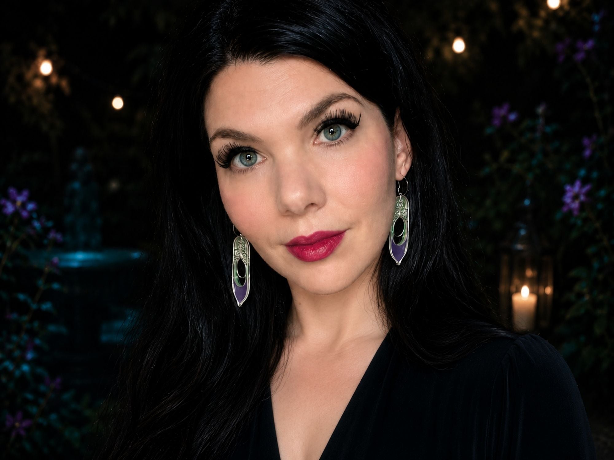 Model wearing Galadriel fantasy statement earrings against dark atmospheric background