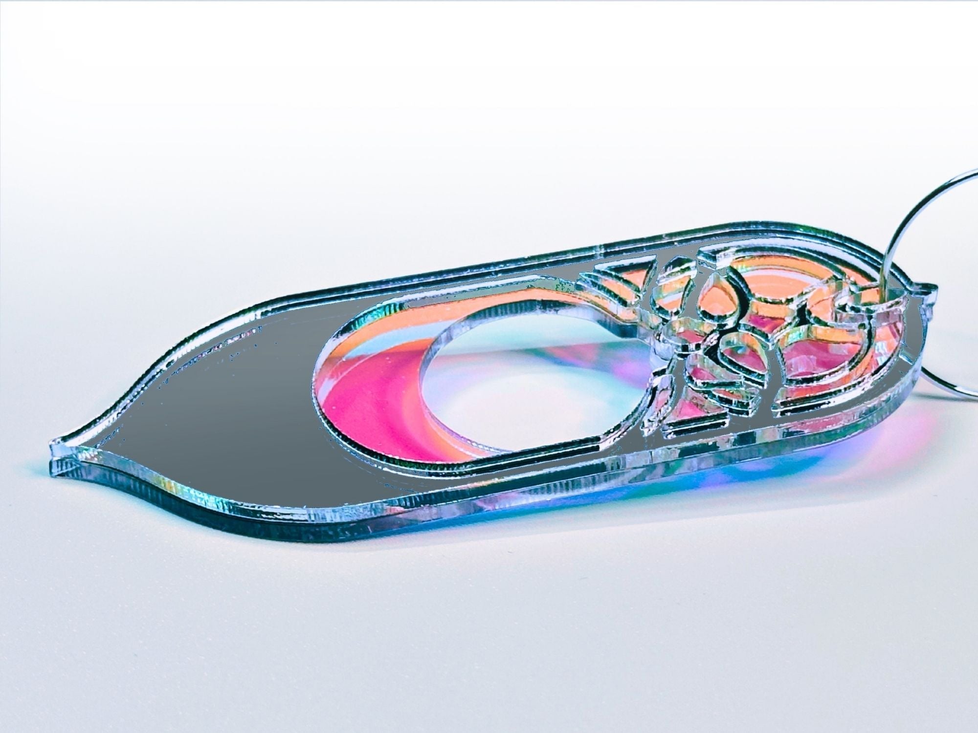 Iridescent acrylic Galadriel statement earrings with silver mirror detailing on soft gradient background